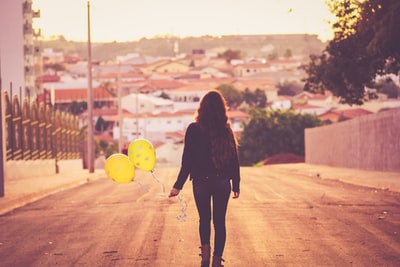 Woman holding a balloon
